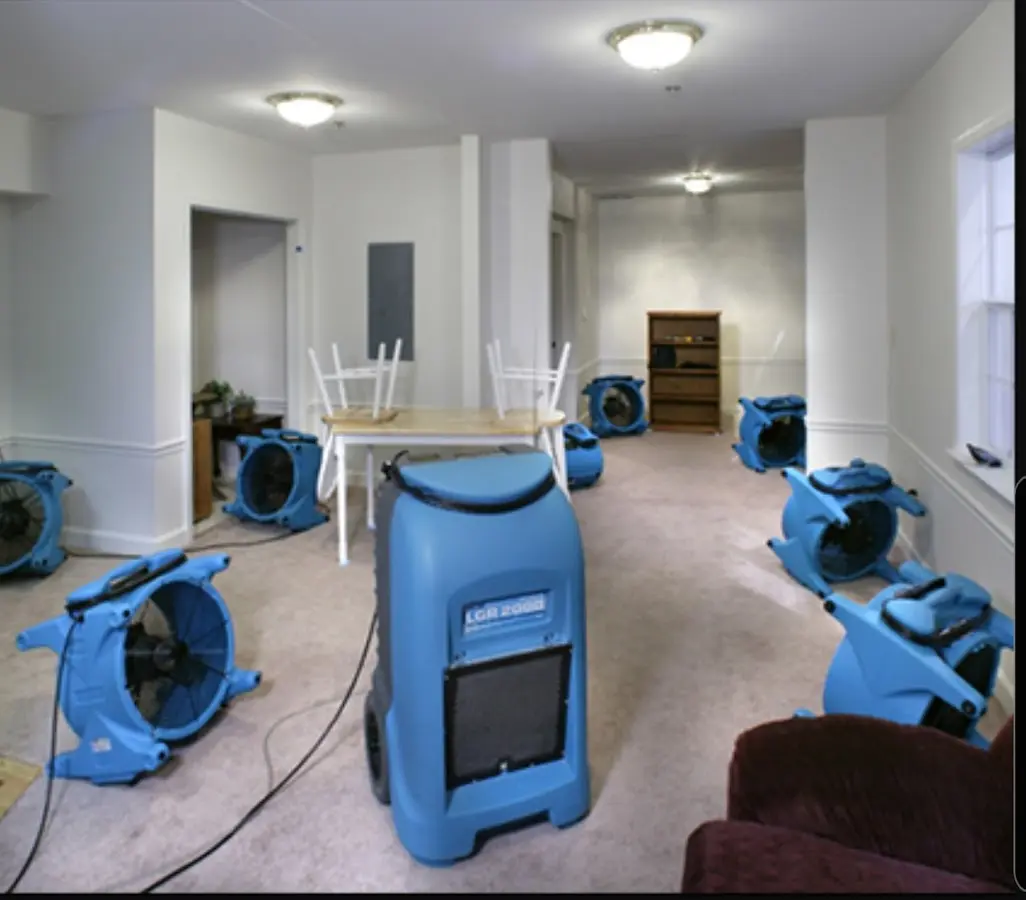 Air movers and dehumidifier setup for Water Damage Restoration in Monroe